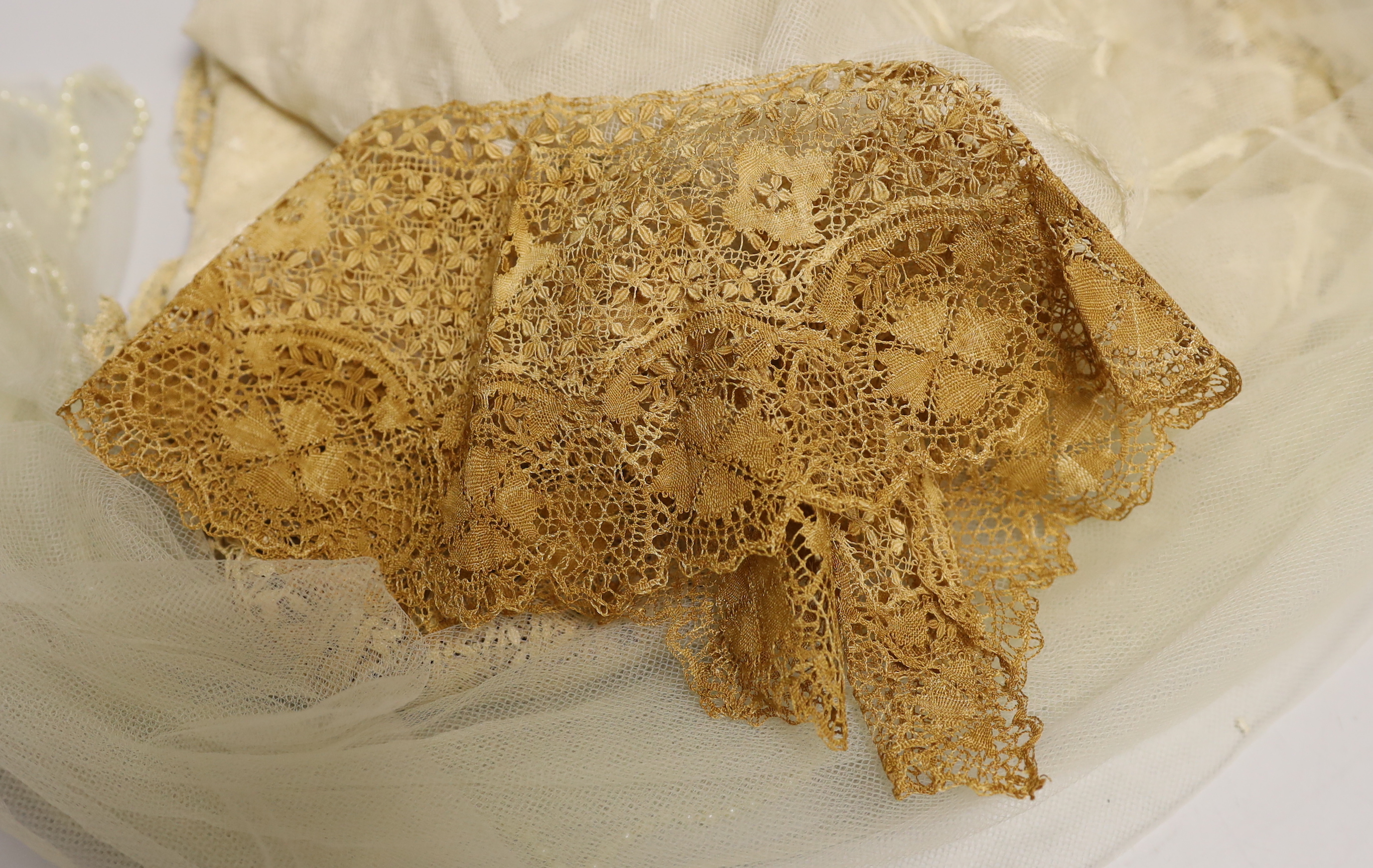 A silk Maltese lace trim, mixed lace and a pearl edged veil